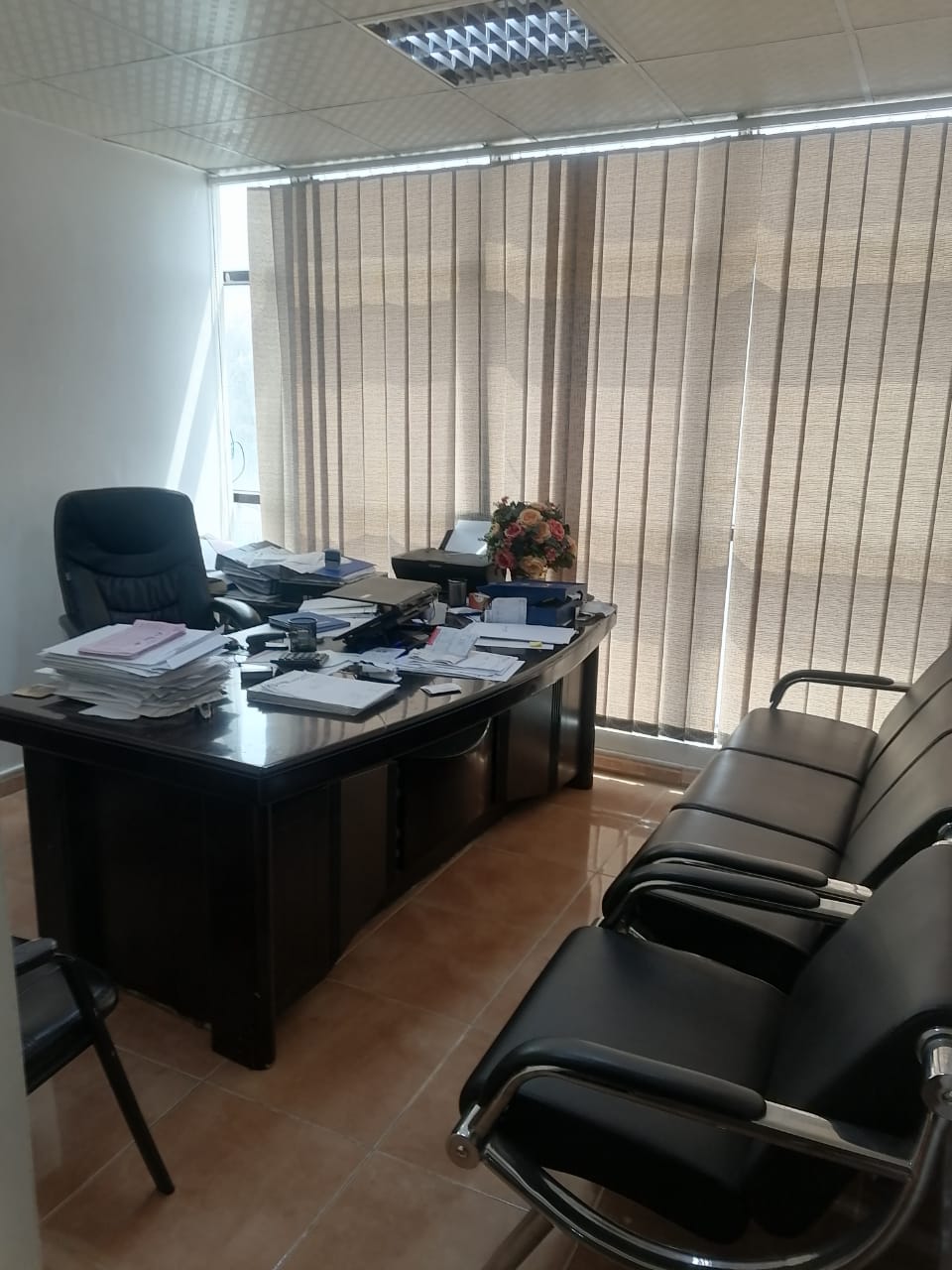 Management office with desk and visitor seating